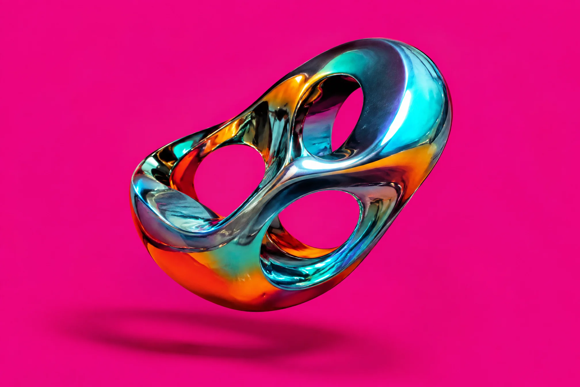 Iridescent chrome sculpture floating over hot magenta